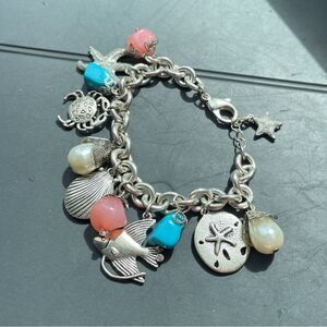 Charm bracelet in Silver Plate with cute Beach theme. 12 charms.